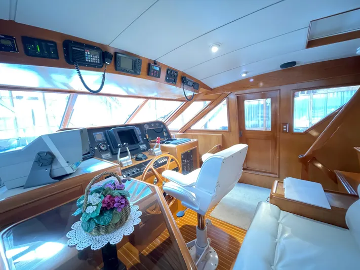Wind Star Yacht Photos Pics Luxurious 1993 Ocean Alexander 520 Pilothouse interior with navigation equipment and elegant seating.