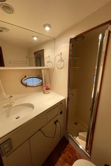 Wind Star Yacht Photos Pics Bathroom interior of 1993 Ocean Alexander 520 Pilothouse yacht with shower and vanity.