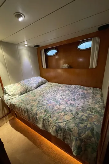 Wind Star Yacht Photos Pics Cozy bedroom in 1993 Ocean Alexander 520 Pilothouse yacht with floral bedding.