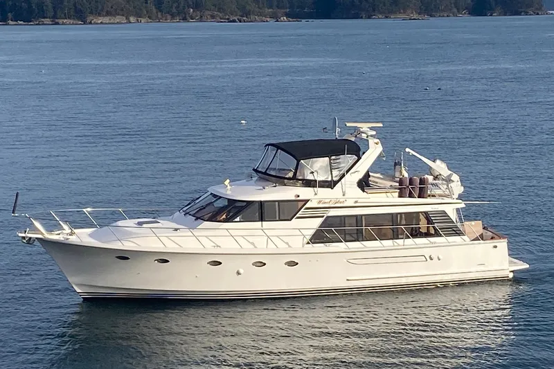 Wind Star Yacht Photos Pics Ocean Alexander 520 Pilothouse yacht, 1993 model, cruising on calm waters.