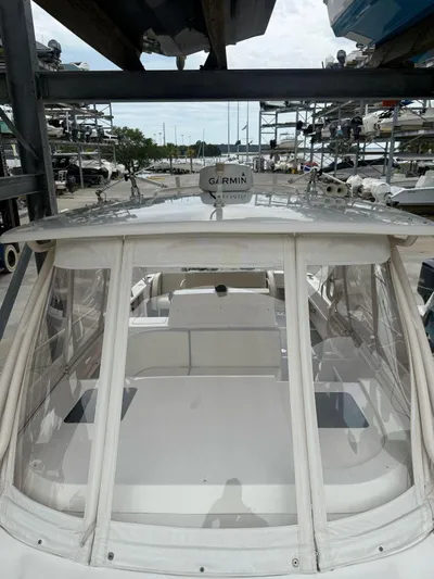 Soggy Dollars Yacht Photos Pics 2007 Intrepid 35 Walkaround boat with Garmin equipment, docked in a marina.