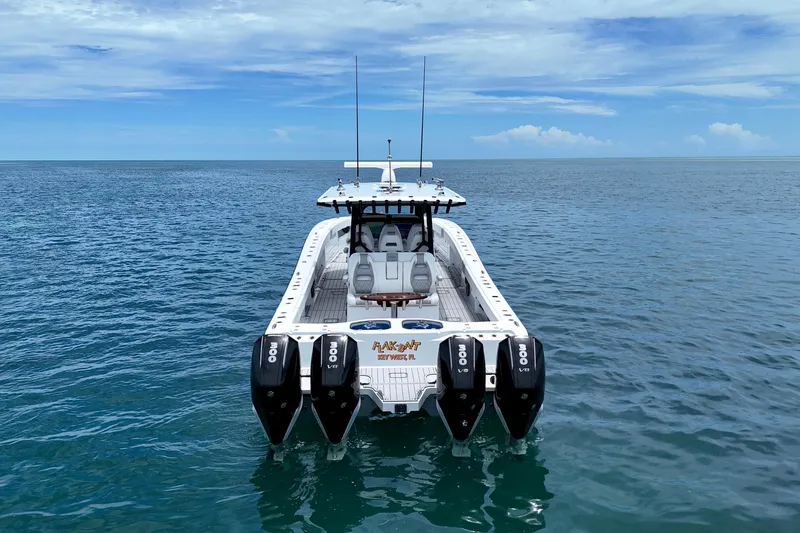  Yacht Photos Pics 2023 Freeman 43 boat with four engines on open water under a clear sky.