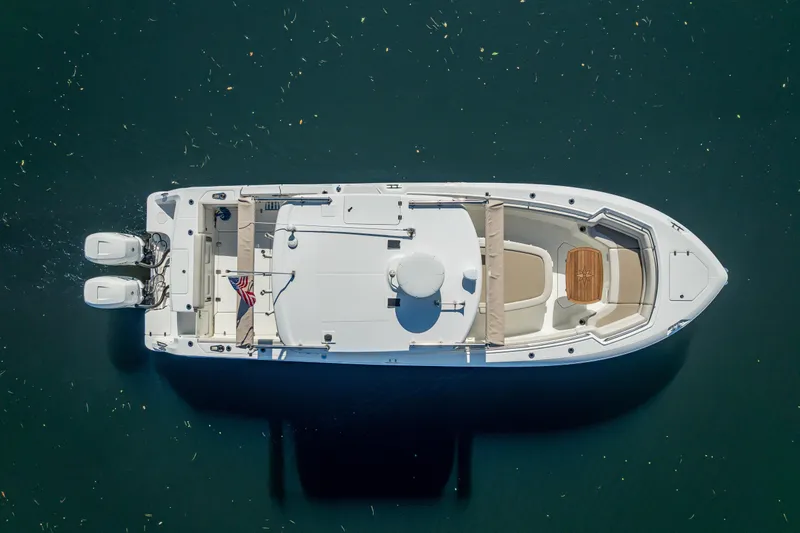 New Seakeeper- 110 Engine Hours- Obo Yacht Photos Pics Aerial view of 2017 Boston Whaler 330 Outrage boat on calm water.