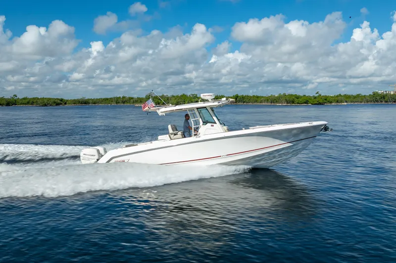 New Seakeeper- 110 Engine Hours- Obo Yacht Photos Pics 2017 Boston Whaler 330 Outrage cruising on a sunny day with clear skies.