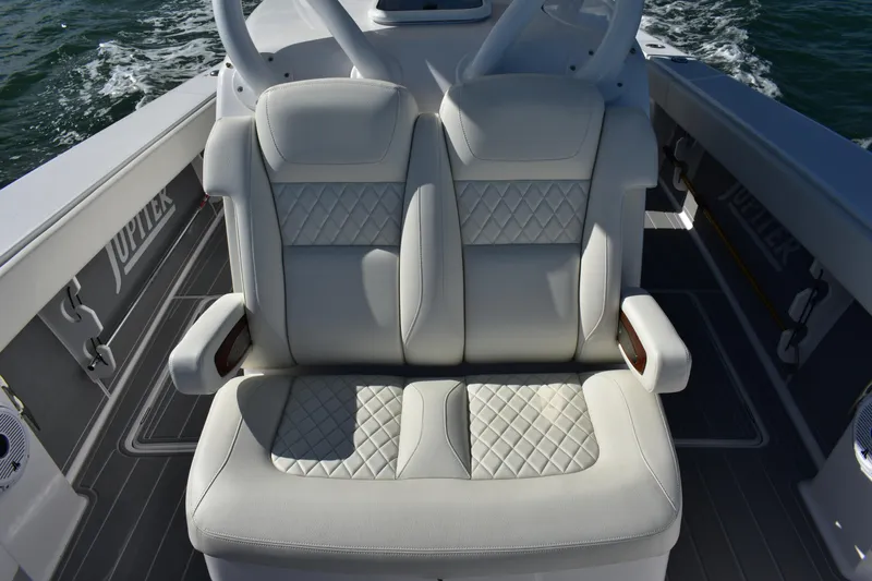 Full Circle Yacht Photos Pics Luxurious seating on 2025 Jupiter 32 FS boat with quilted upholstery.
