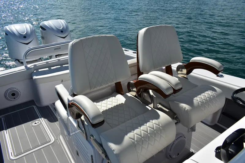 Full Circle Yacht Photos Pics Luxurious seating on 2025 Jupiter 32 FS boat with dual engines, on calm water.