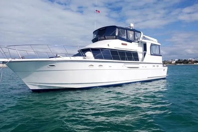 Traveller Yacht Photos Pics 1996 Jefferson 52 Rivanna Cockpit MY yacht on open water under a partly cloudy sky.