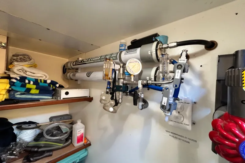 Traveller Yacht Photos Pics Water filtration system in a 1996 Jefferson 52 Rivanna Cockpit MY boat storage area.