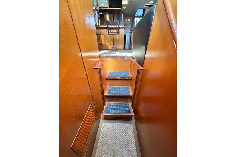 Traveller Yacht Photos Pics Interior stairs of 1996 Jefferson 52 Rivanna Cockpit MY yacht, featuring wooden finish.