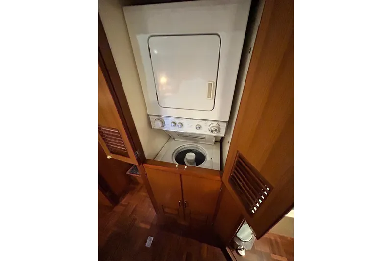 Traveller Yacht Photos Pics Laundry area inside 1996 Jefferson 52 Rivanna Cockpit MY yacht with wood cabinetry.