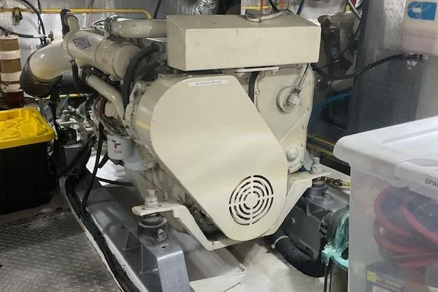 Traveller Yacht Photos Pics Engine room of 1996 Jefferson 52 Rivanna Cockpit MY yacht, featuring a well-maintained engine.