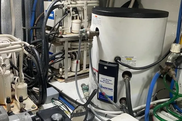 Traveller Yacht Photos Pics Engine room of 1996 Jefferson 52 Rivanna Cockpit MY with marine equipment and wiring.