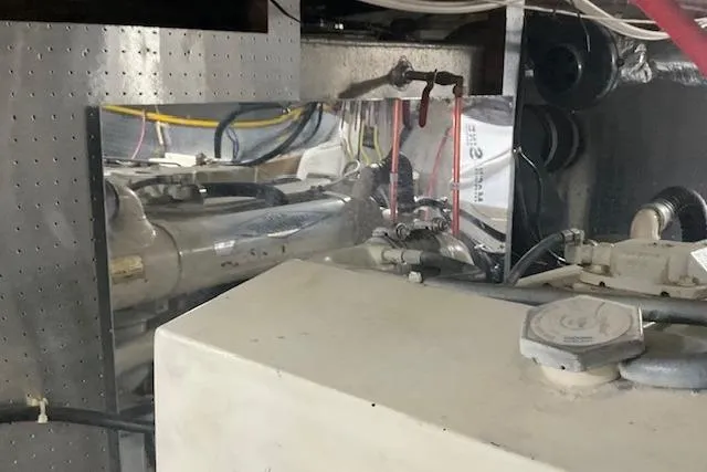 Traveller Yacht Photos Pics Engine room of a 1996 Jefferson 52 Rivanna Cockpit MY yacht, showcasing mechanical components.