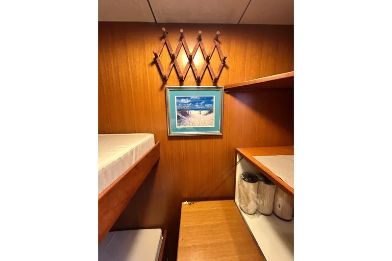 Traveller Yacht Photos Pics Interior of 1996 Jefferson 52 Rivanna Cockpit MY with wooden paneling and bunk beds.