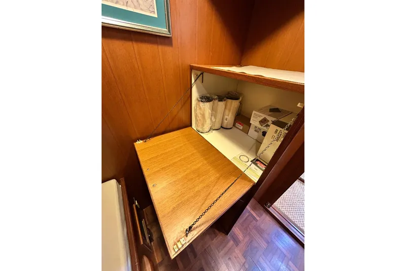 Traveller Yacht Photos Pics Storage compartment on 1996 Jefferson 52 Rivanna Cockpit MY yacht with wooden finish.