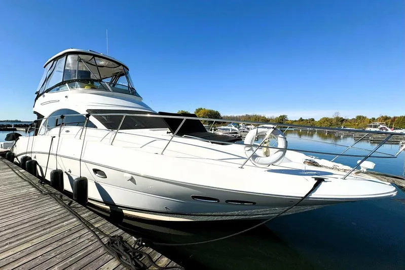  Yacht Photos Pics 2008 Sea Ray 47 Sedan Bridge yacht docked on a sunny day.