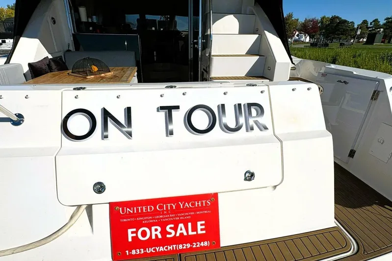  Yacht Photos Pics 2008 Sea Ray 47 Sedan Bridge yacht for sale, rear view with "On Tour" signage.