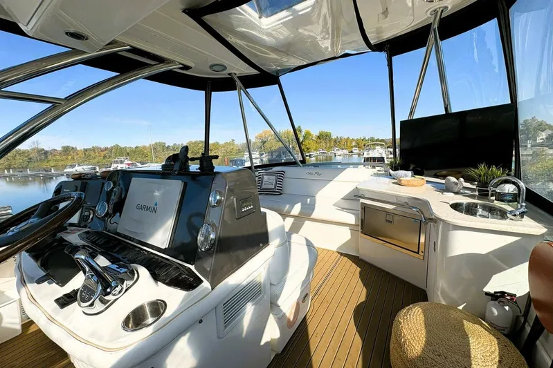  Yacht Photos Pics 2008 Sea Ray 47 Sedan Bridge yacht interior with modern helm and kitchenette.