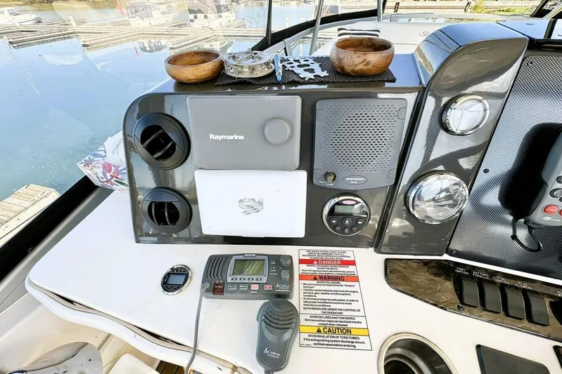  Yacht Photos Pics 2008 Sea Ray 47 Sedan Bridge helm with Raymarine electronics and control panel.