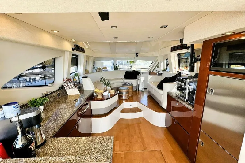  Yacht Photos Pics Luxurious interior of 2008 Sea Ray 47 Sedan Bridge yacht with modern kitchen and seating area.