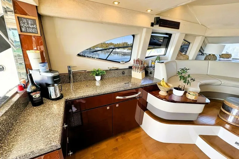  Yacht Photos Pics Luxurious 2008 Sea Ray 47 Sedan Bridge yacht interior with modern kitchen and seating area.