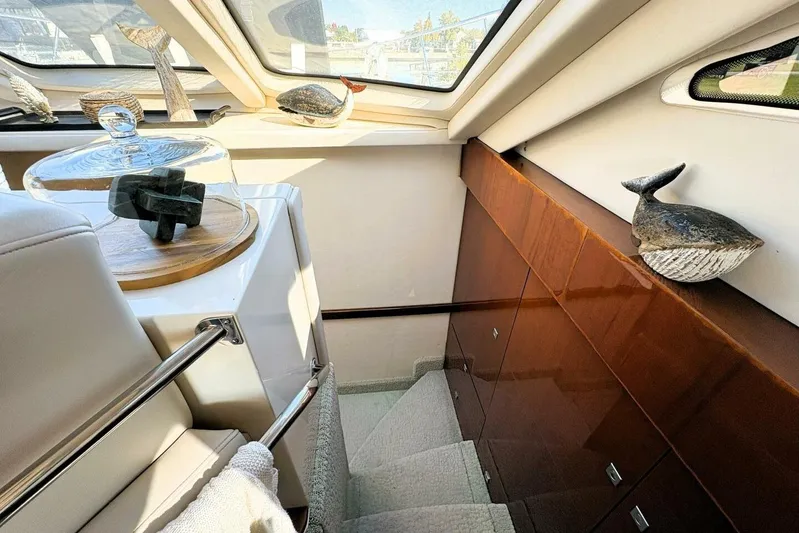  Yacht Photos Pics Interior of 2008 Sea Ray 47 Sedan Bridge with decorative marine-themed sculptures.