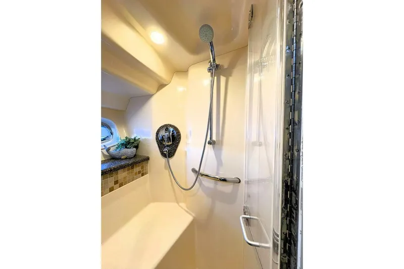  Yacht Photos Pics Luxurious shower in 2008 Sea Ray 47 Sedan Bridge yacht, featuring modern fixtures and elegant design.