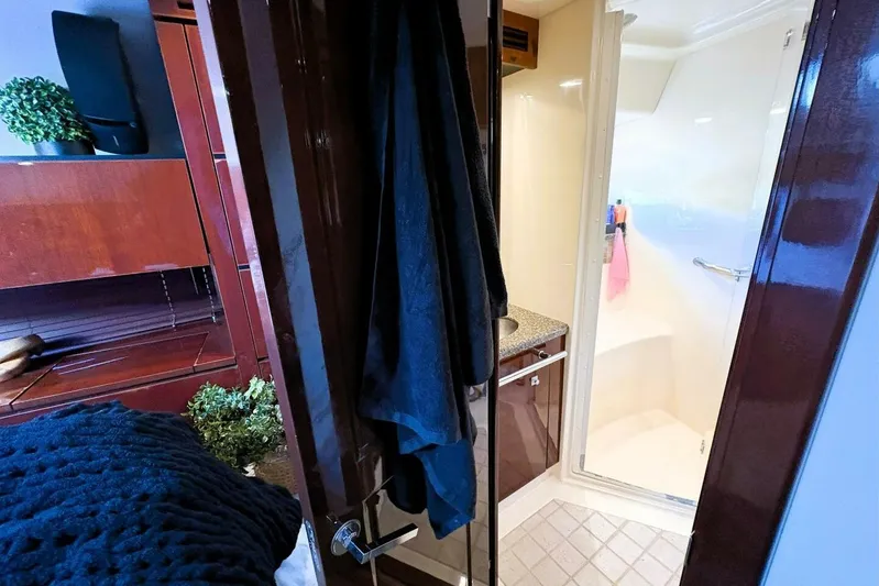  Yacht Photos Pics Interior of 2008 Sea Ray 47 Sedan Bridge yacht bathroom with wooden cabinetry.