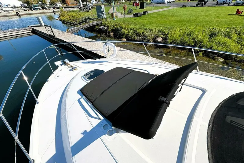  Yacht Photos Pics 2008 Sea Ray 47 Sedan Bridge yacht docked by a scenic marina.