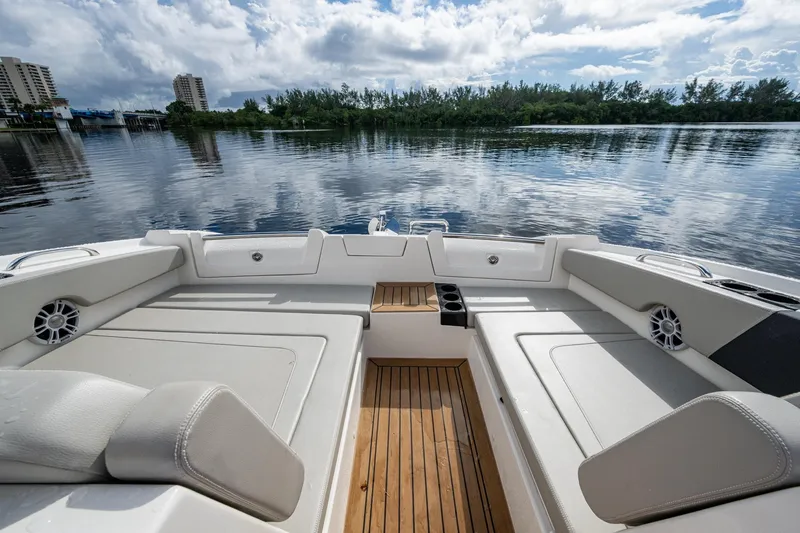  Yacht Photos Pics 2023 Aquila 32 Power Cat interior with spacious seating and scenic water view.