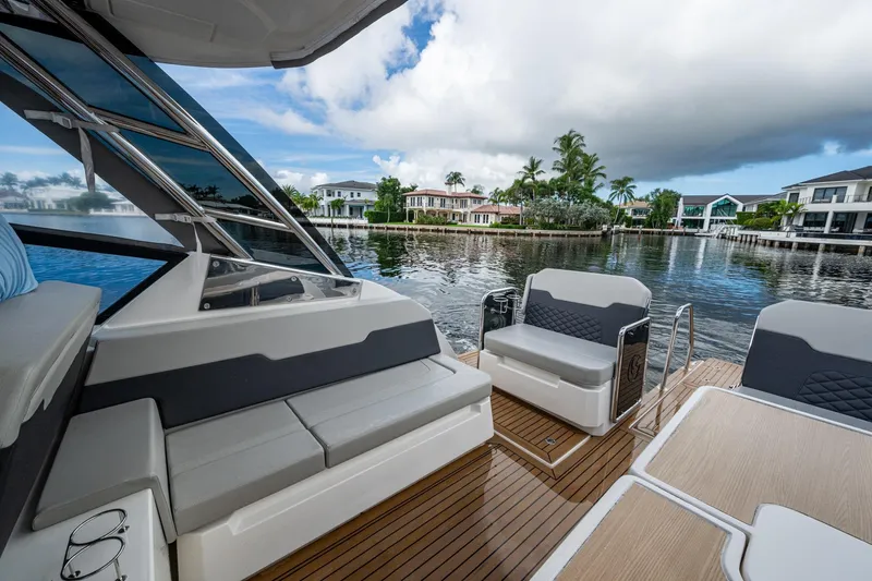  Yacht Photos Pics Aquila 32 Power Cat 2023 interior with luxurious seating and scenic waterfront view.