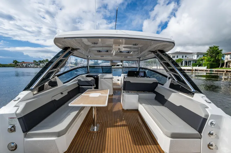  Yacht Photos Pics 2023 Aquila 32 Power Cat interior with spacious seating and elegant design on the water.