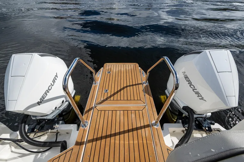  Yacht Photos Pics 2023 Aquila 32 Power Cat with twin Mercury engines and teak swim platform.