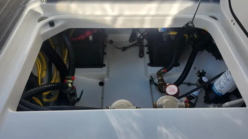  Yacht Photos Pics 2024 Pursuit DC 266 Dual Console engine compartment with visible wiring and components.