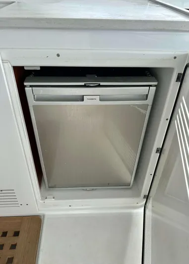 Drifter Yacht Photos Pics Built-in refrigerator on a 2023 Lagoon 46 yacht, with a sleek, modern design.