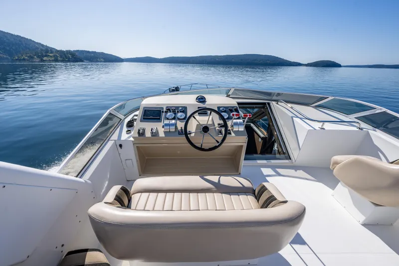 Clancy's Yacht Photos Pics 2004 Navigator Classic 5300 yacht helm with serene ocean view.