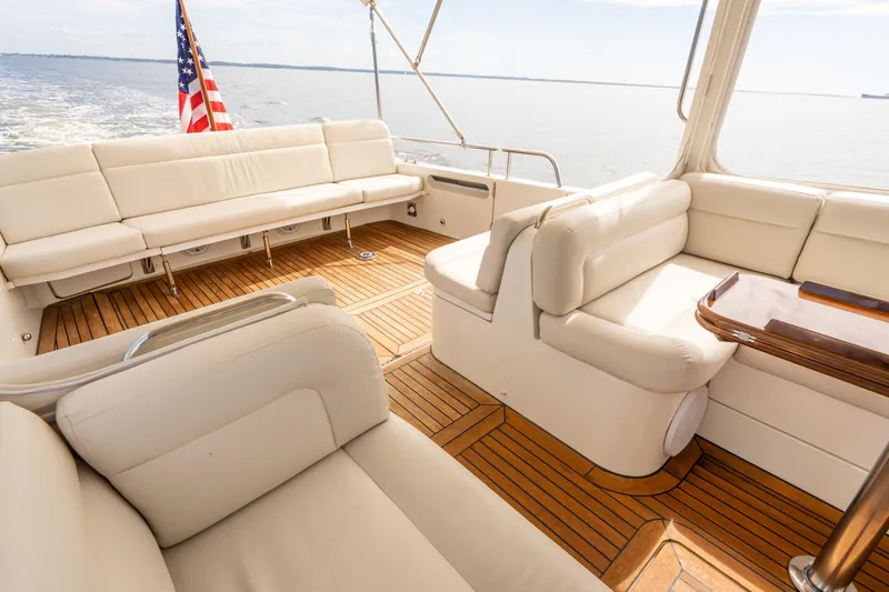 Ephemera Yacht Photos Pics Luxurious 2009 MJM 40z yacht interior with elegant seating and wooden flooring.