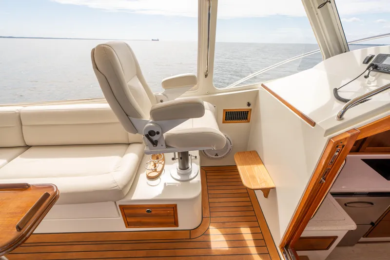 Ephemera Yacht Photos Pics Luxurious interior of a 2009 MJM 40z yacht with leather seating and wooden flooring.