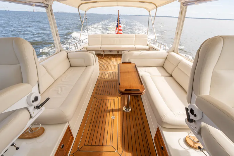 Ephemera Yacht Photos Pics Luxurious 2009 MJM 40z yacht interior with elegant seating and wooden flooring on open water.