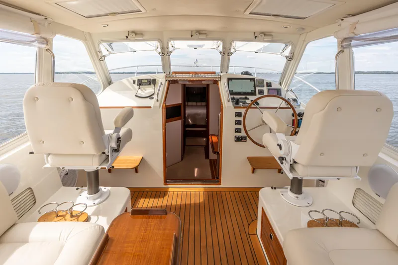 Ephemera Yacht Photos Pics Luxurious 2009 MJM 40z yacht interior with elegant seating and wooden flooring.