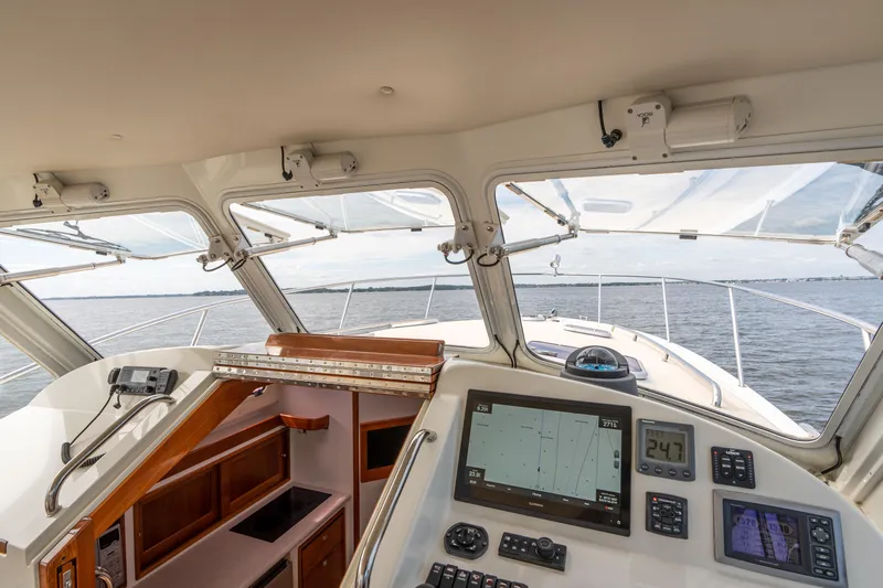 Ephemera Yacht Photos Pics Interior view of 2009 MJM 40z yacht cockpit with navigation equipment and ocean view.