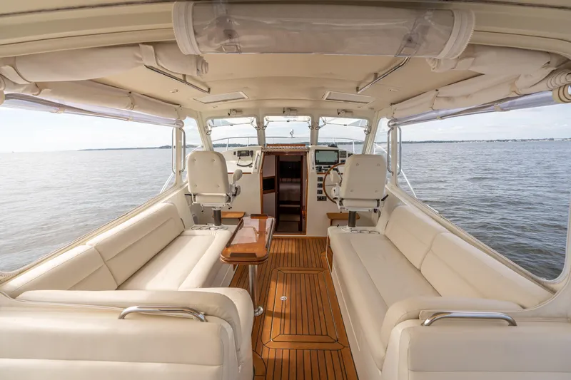 Ephemera Yacht Photos Pics Luxurious interior of a 2009 MJM 40z yacht with elegant seating and wooden flooring.