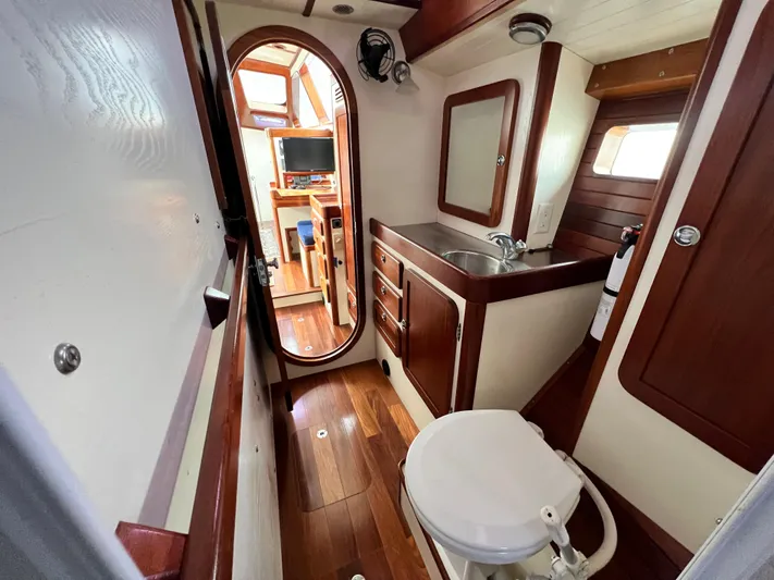 Malabar Yacht Photos Pics Luxurious 2014 Custom 53' Expedition yacht bathroom with wood accents and modern amenities.