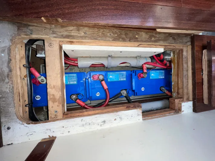 Malabar Yacht Photos Pics Battery compartment of 2014 Custom 53' Expedition Voyaging Lifting Keeler with blue batteries.