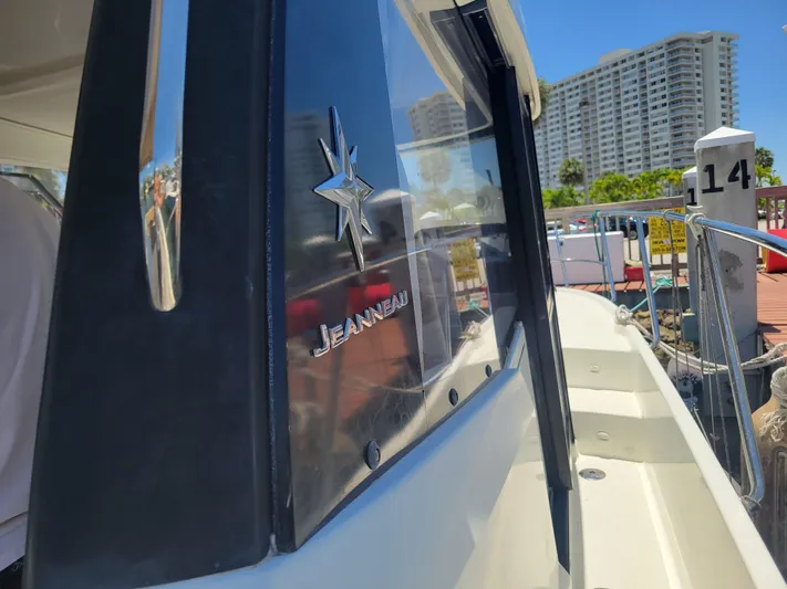 Supervielle Yacht Photos Pics 2016 Jeanneau Merry Fisher 855 boat docked, showcasing sleek design and branding.