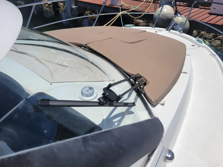 Supervielle Yacht Photos Pics 2016 Jeanneau Merry Fisher 855 boat deck with windshield and sunpad.