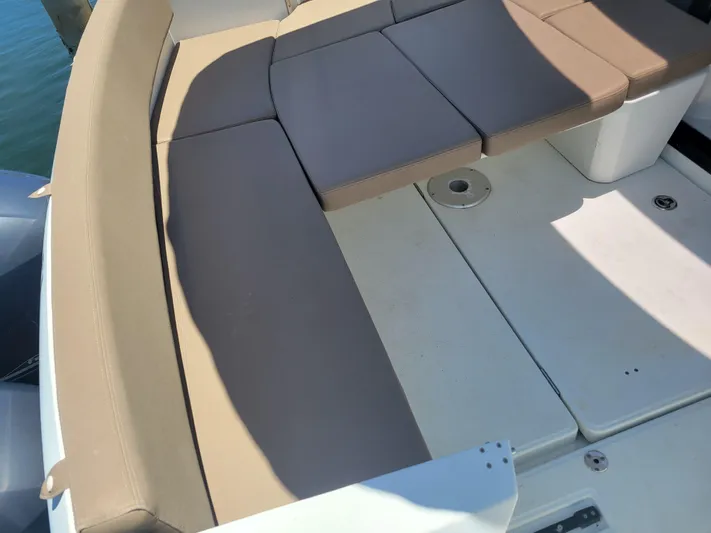 Supervielle Yacht Photos Pics Jeanneau Merry Fisher 855, 2016 model, featuring beige seating and deck area.