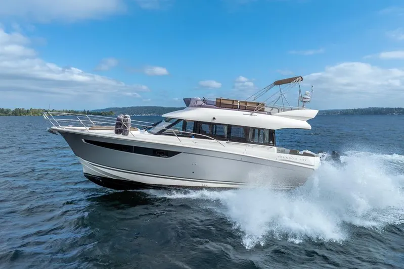  Yacht Photos Pics 2016 Jeanneau Velasco 43F yacht cruising on open water under a clear blue sky.