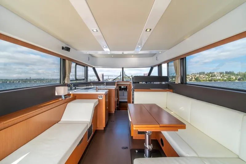  Yacht Photos Pics Interior of 2016 Jeanneau Velasco 43F yacht with modern seating and panoramic windows.