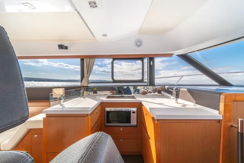  Yacht Photos Pics Interior of 2016 Jeanneau Velasco 43F yacht with modern kitchen and ocean view.